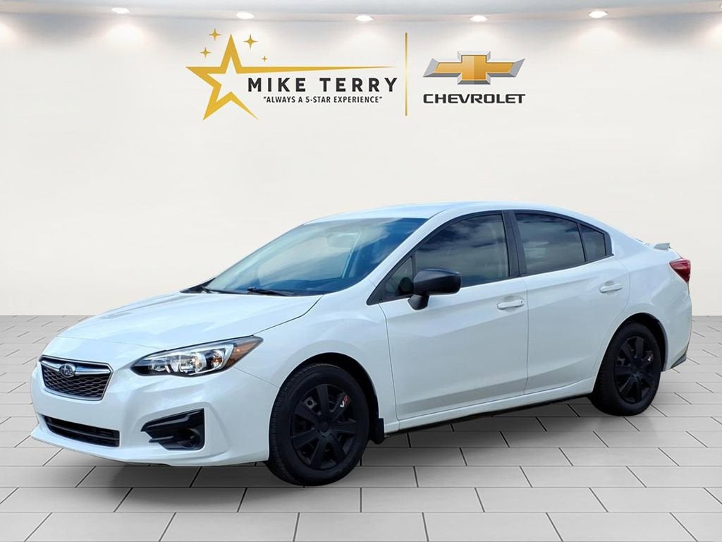 2019 Subaru Impreza 2.0i in White — front three-quarter view